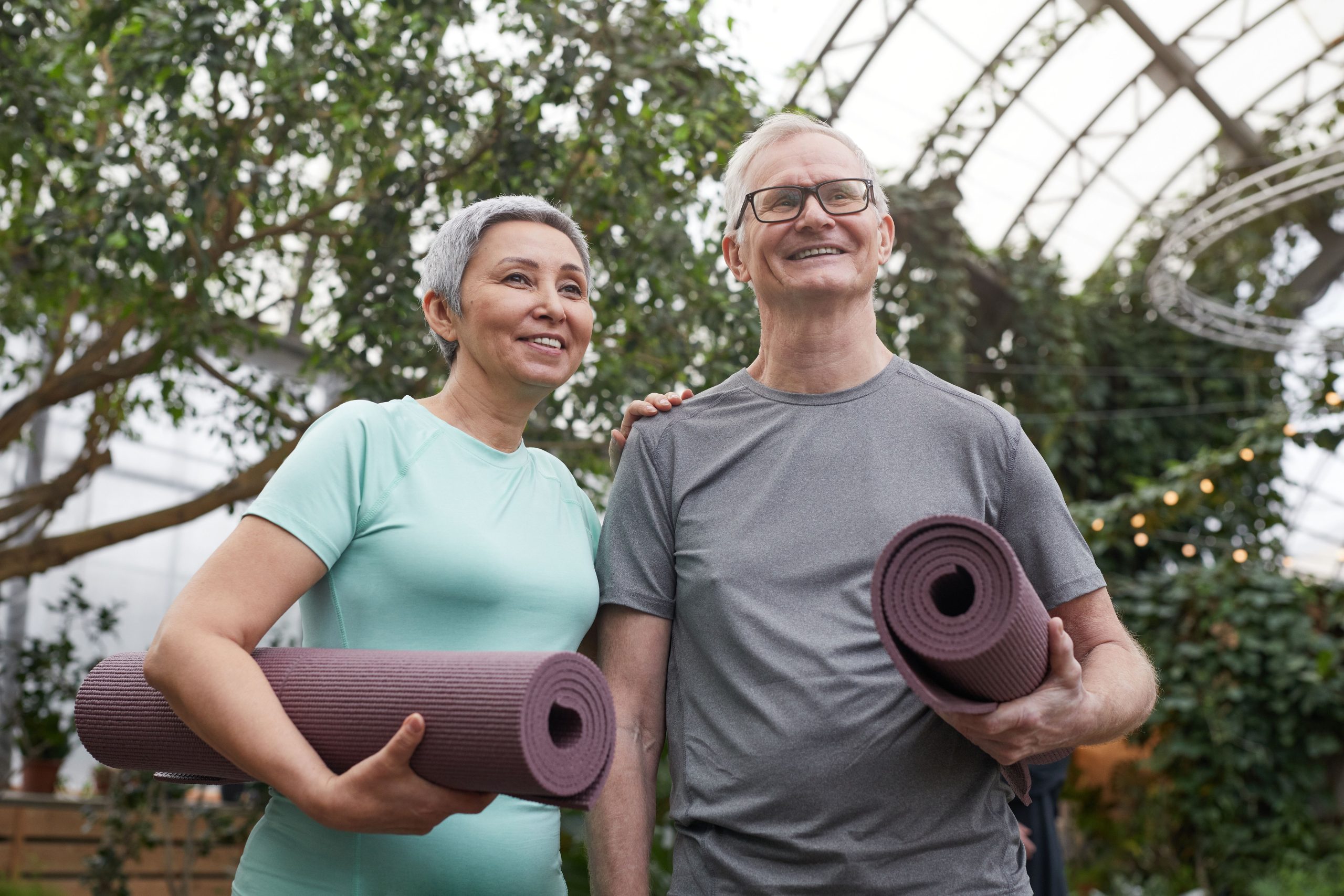 two seniors doing yoga